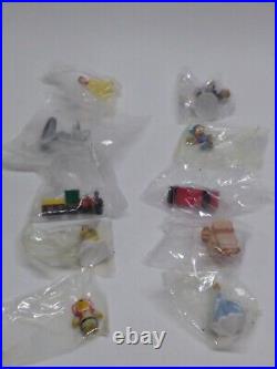 10 miniature Disney Collector Pack Theme Park Series figurines